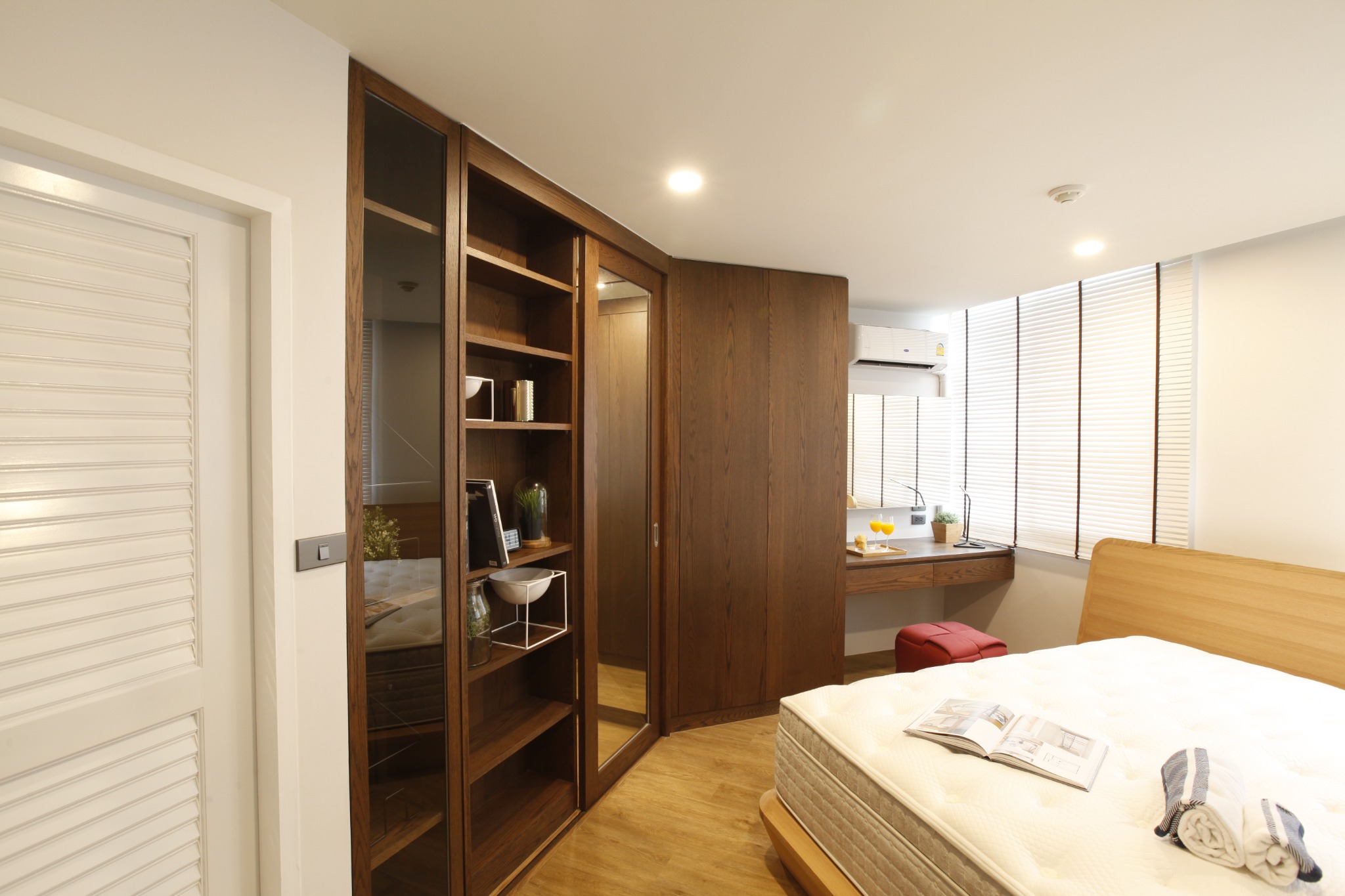 Bedroom with full-height timber wardrobe, mirror and integrated desk