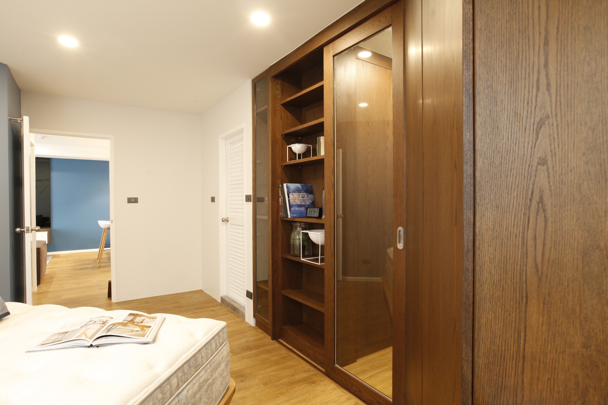 Bedroom wardrobe and sliding timber door with open shelving
